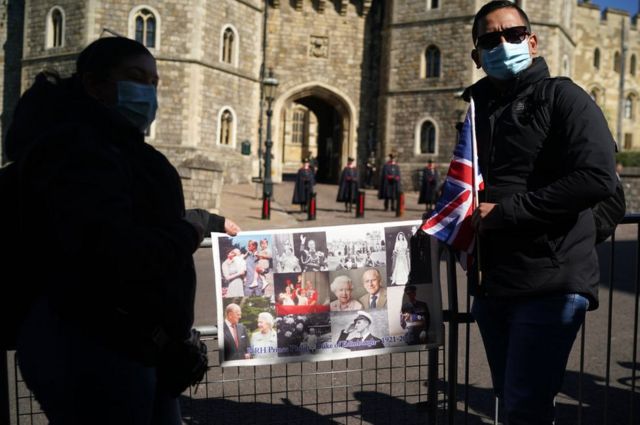 Mourners gather outside Windsor Castle for the funeral of Prince Philip, Duke of Edinburgh on April 17, 2021 in Windsor, England.