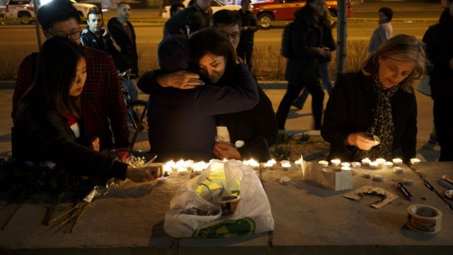 Mourners leave candles and messages on Yonge Street after the attack