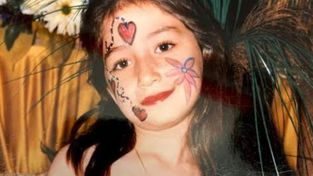 Maya as a child in a party