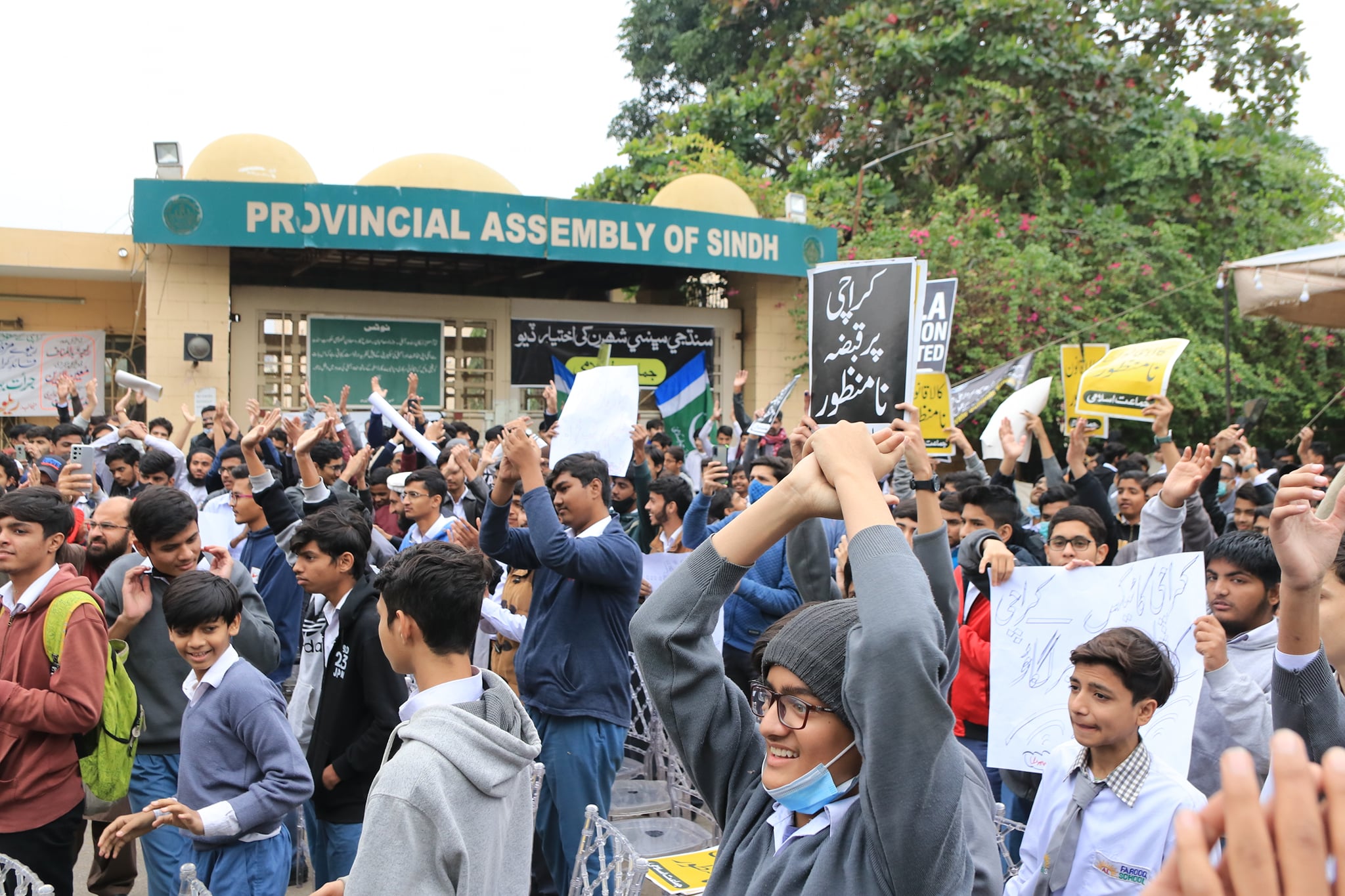 May be an image of 1 person, standing, outdoors and crowd