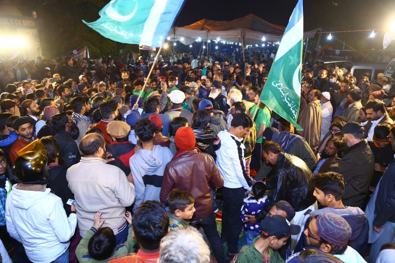 May be an image of 1 person, standing, outdoors and crowd