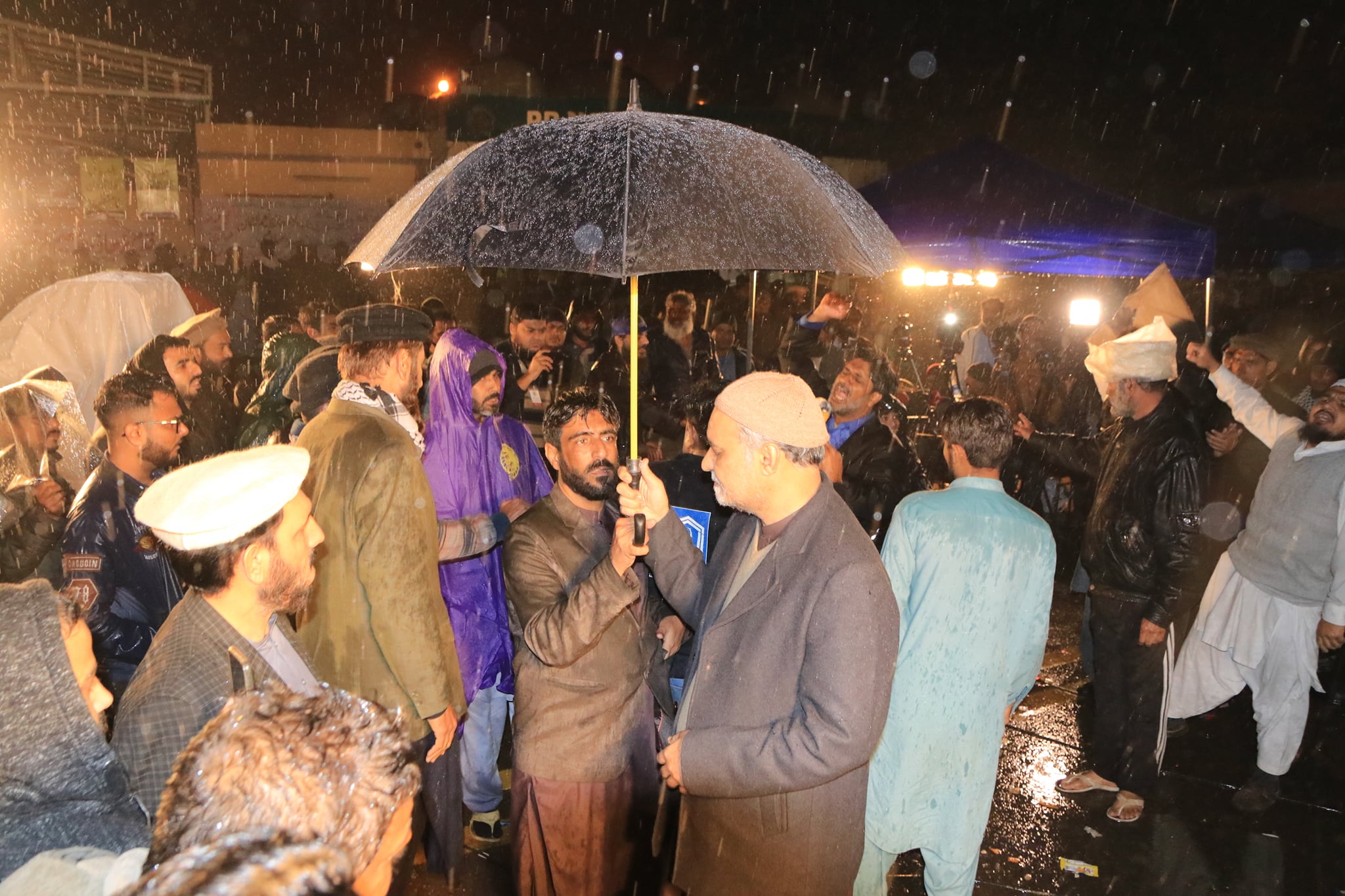 May be an image of 8 people, people standing and body of water