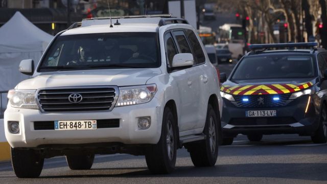 White vehicle with police escort believed to be carrying Salah Abdeslam