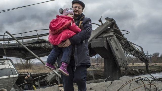 cross amid rubble of a damaged bridge in the Irpin city near from Kyiv (Kiev), Ukraine, 06 March 2022
