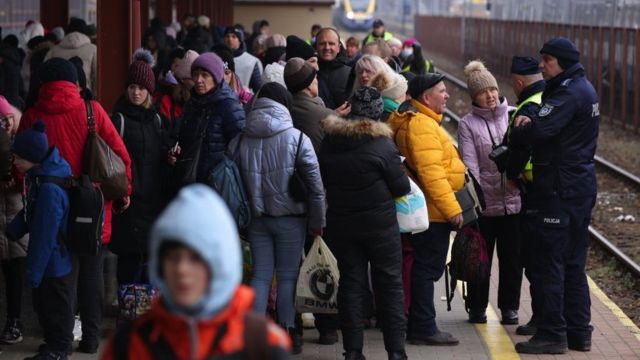 People who have arrived from war-torn Ukraine wait for specially chartered trains that will take them to other cities in Poland and Europe on a platform at the main train station on March 07, 2022 in Przemysl, Poland.