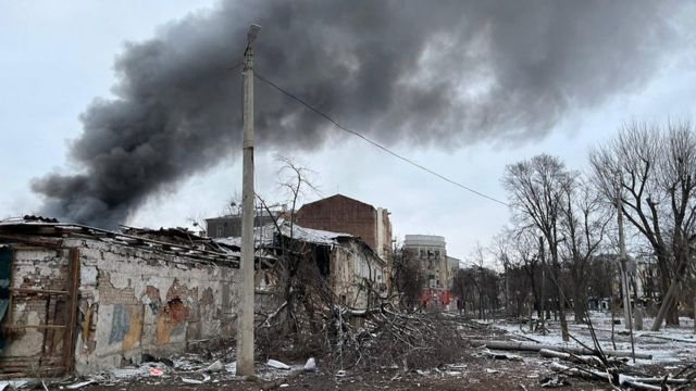 Smoke billows from a damaged building in Kharkiv