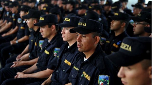 Police officers take part in a graduation and rejoining ceremony at the new headquarters of the Public Force in La Aurora de Heredia, in the outskirts of San Jose, on February 28, 2011.