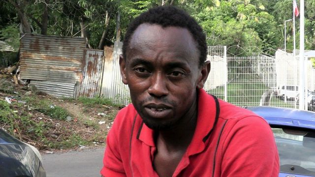 A man in front of a dention centre who says his teenager daughter is being held inside