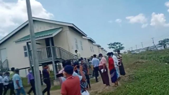 Rohingya refugees being shown the new accommodation