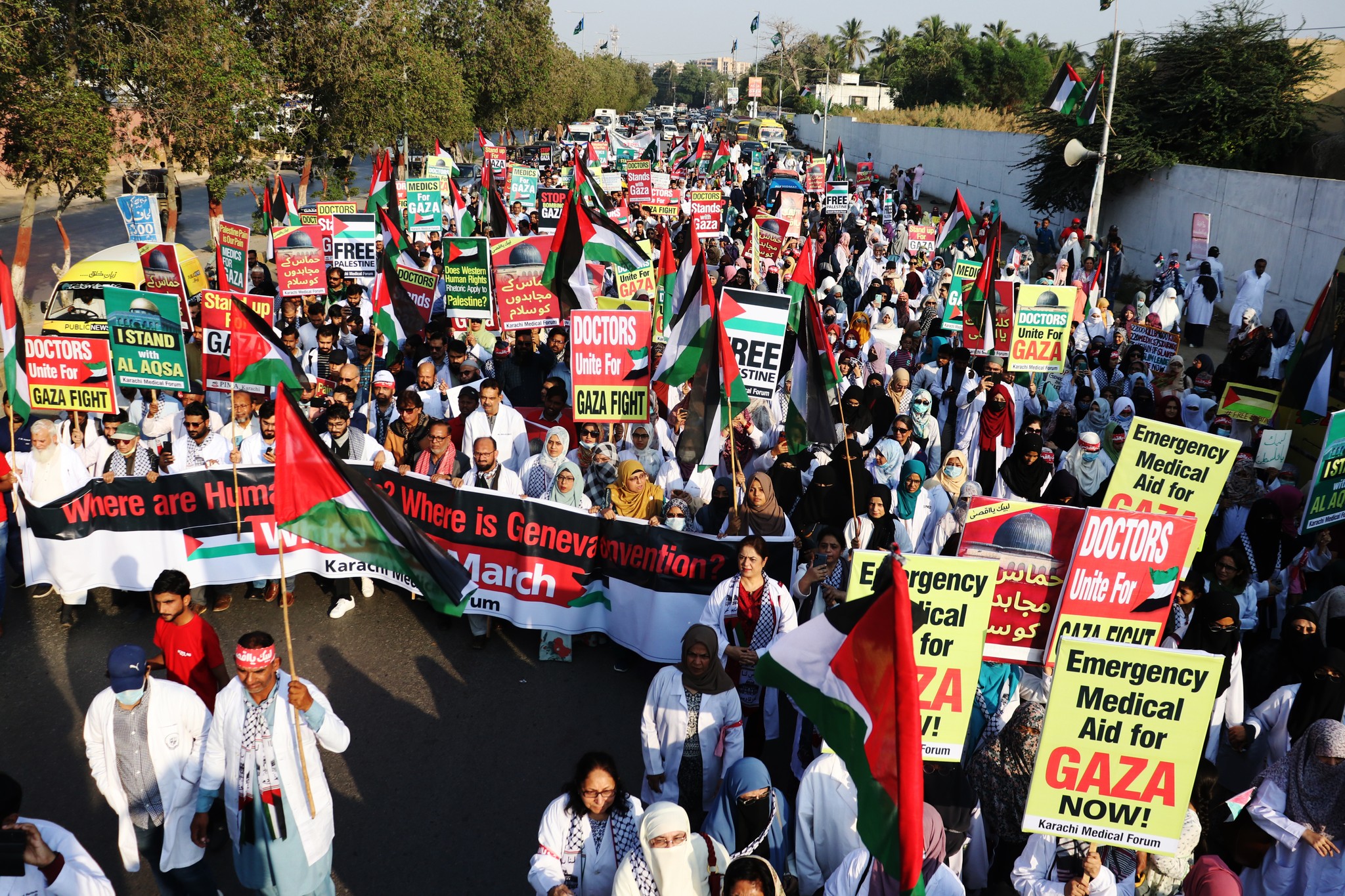 May be an image of 4 people, crowd and text