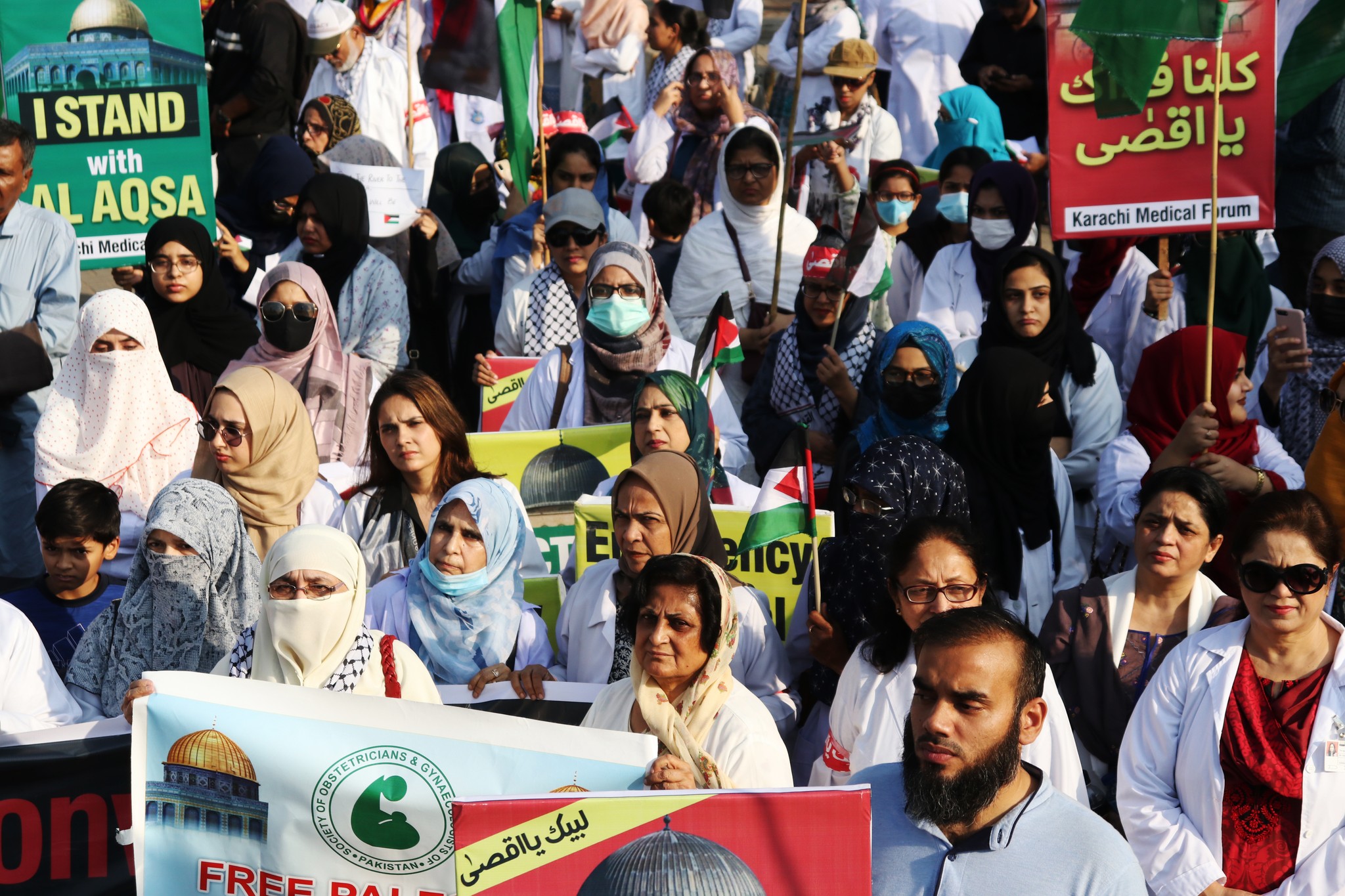 May be an image of 5 people, crowd and text